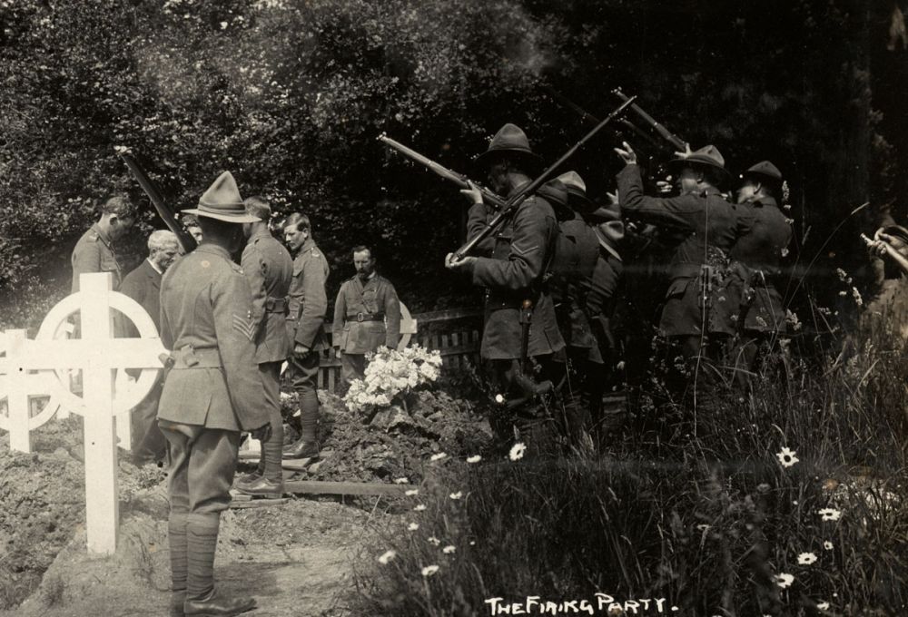 New Zealand soldiers perform a rifle salute at a funeral, Balmer Lawn Hotel, Brockenhurst.